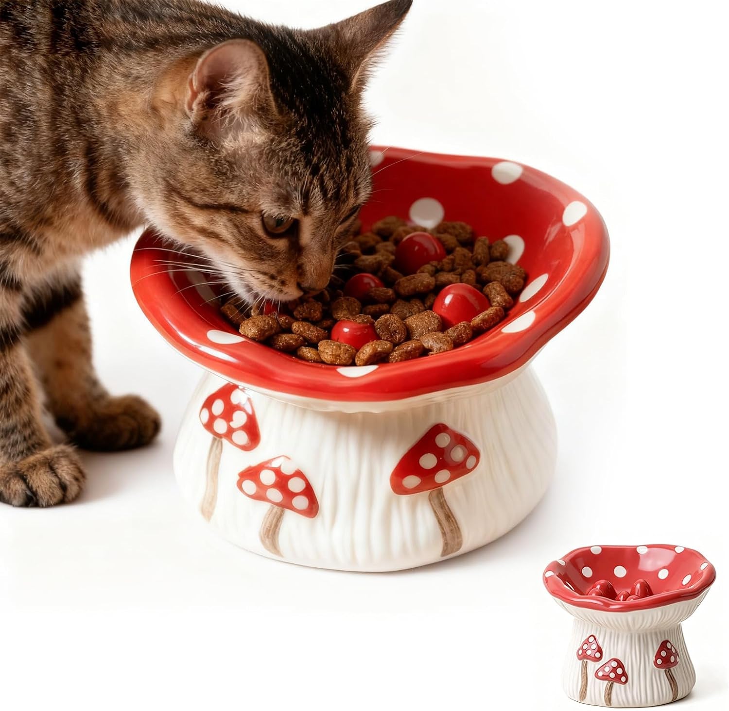 Cat eating from a ceramic mushroom‑design slow feeder bowl with elevated, whisker‑friendly shape and non‑slip base.