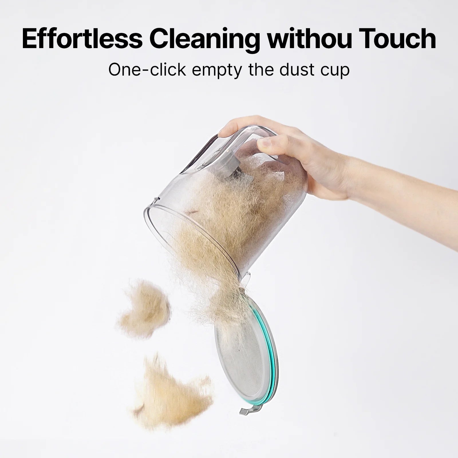 Hand emptying a pet grooming vacuum dust cup with one‑click release.