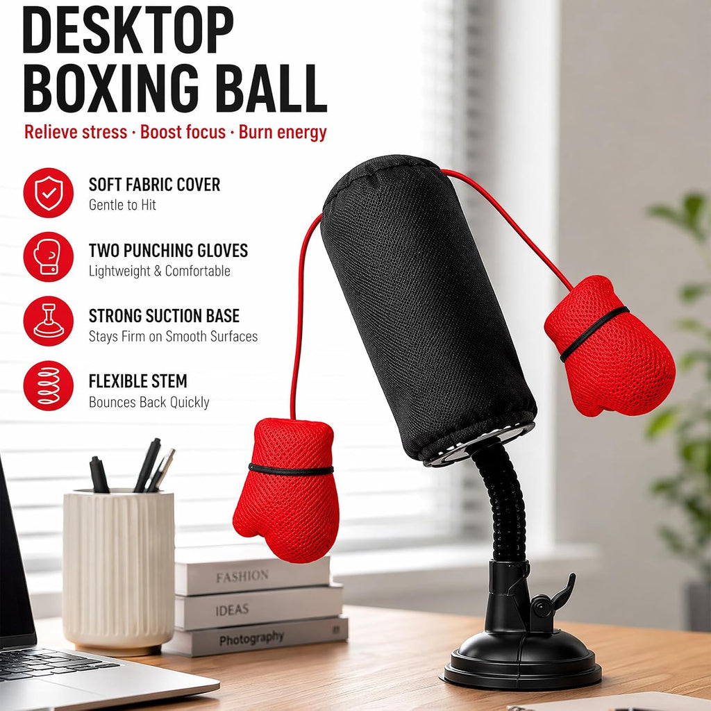  Desktop boxing ball toy on a desk with flexible stem, strong suction base, and red punching gloves for stress relief and focus.
