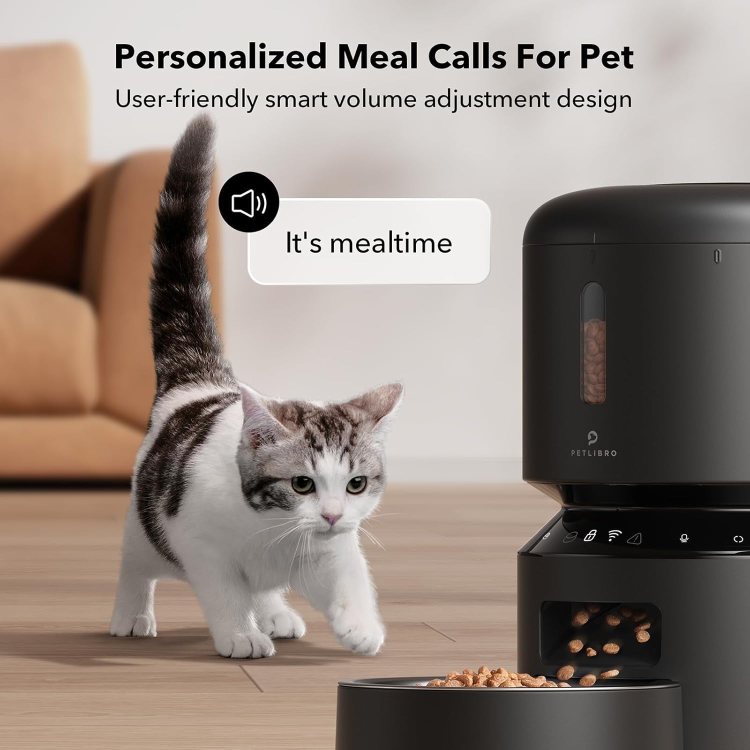 Automatic pet feeder playing a personalized meal call as a cat approaches the food bowl.
