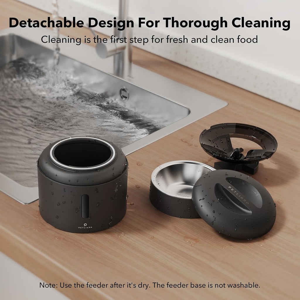 Detachable automatic pet feeder parts drying by a sink, showing easy cleaning design for hygienic pet meals.