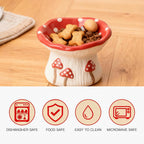 Ceramic mushroom‑design pet bowl holding treats with icons showing dishwasher safe, food safe, easy to clean, and microwave safe features.